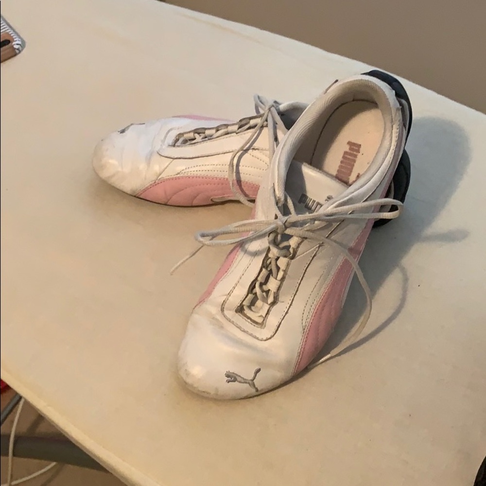 White and Pink PUMA tennis shoes